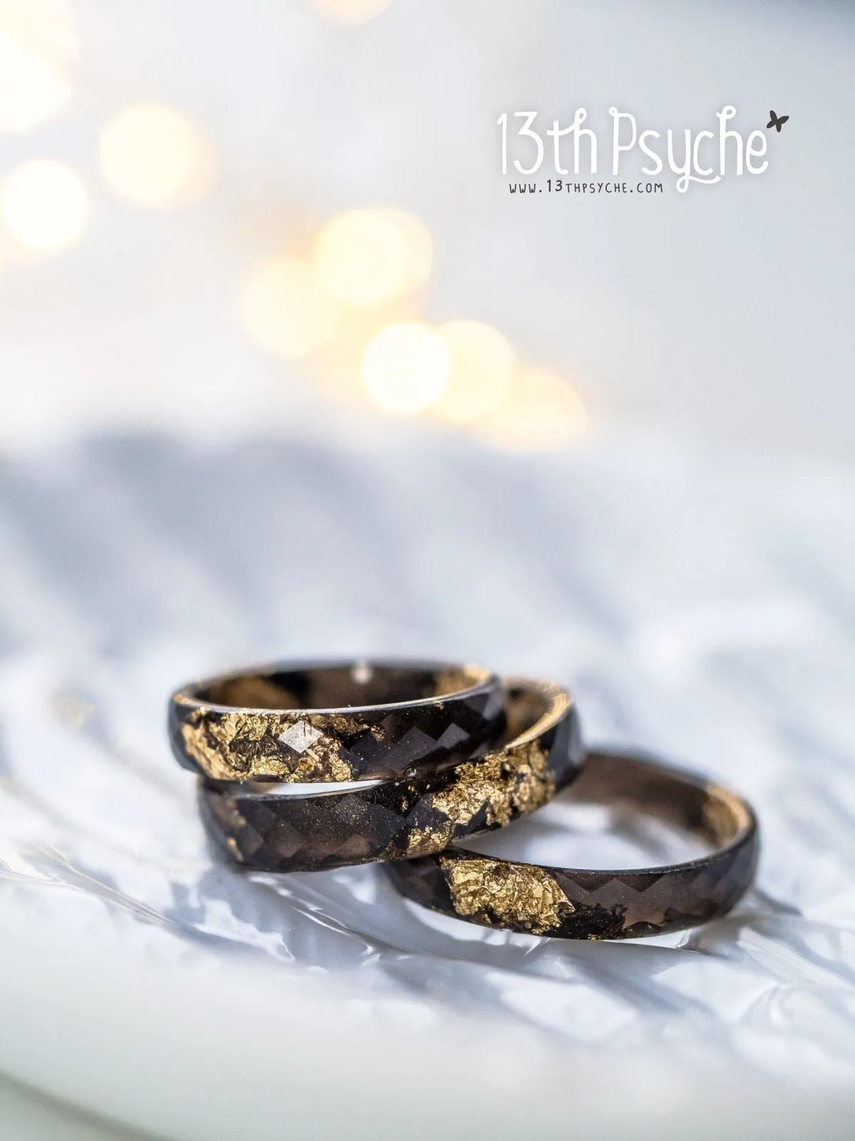 Black faceted resin ring with gold flakes