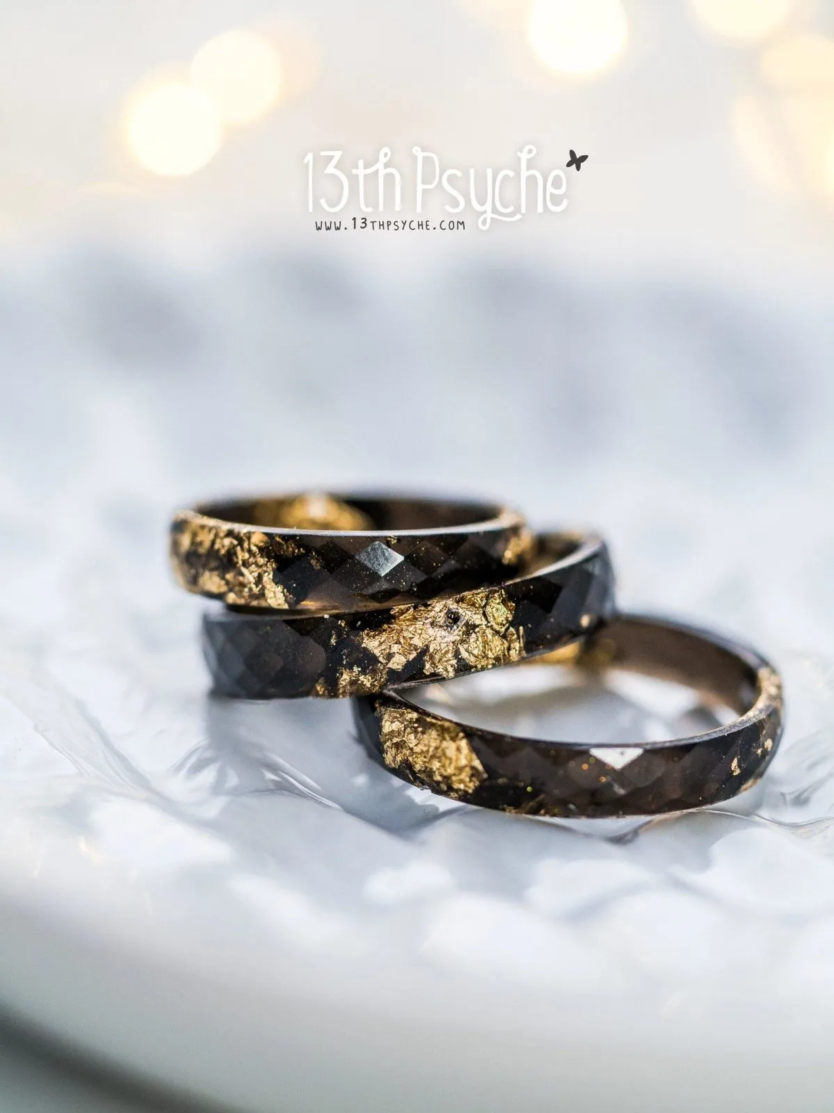 Black faceted resin ring with gold flakes