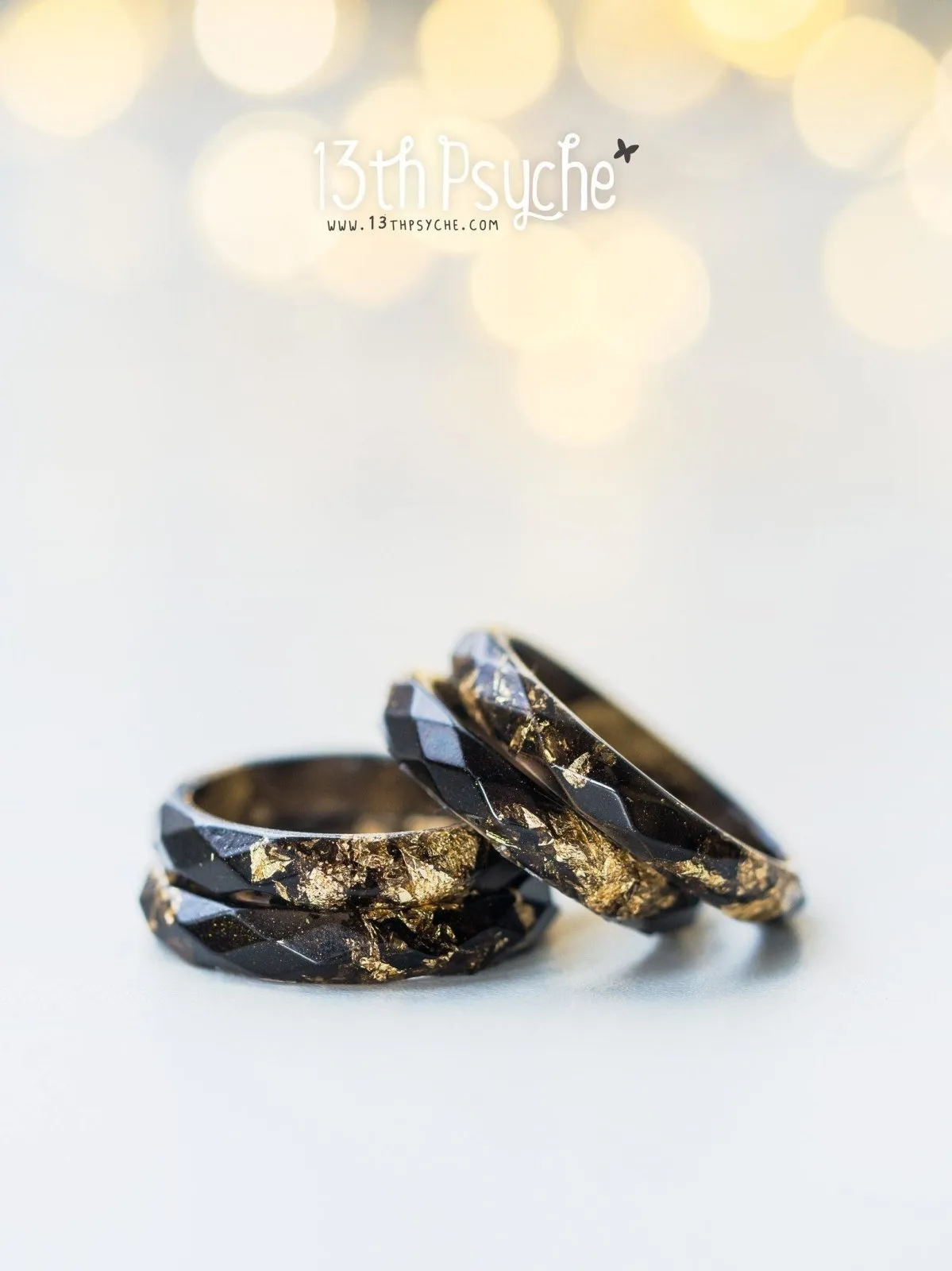 Black faceted resin ring with gold flakes